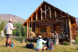 Photo may contain: Housing, Building, Person, Human, Countryside, Outdoors, Nature, Rural, Shelter, House, Cabin, Log Cabin