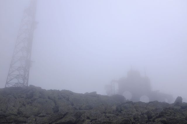 The clouds were thick as we climbed Mount Washington. Structures popped out when we were only steps away. Temperatures around 45 degrees too, with winds around 15 mph. (August 13, 2015)