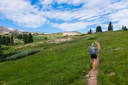 Knock climbing Searle Pass, near Copper Mountain.