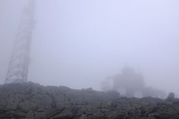 The clouds were thick as we climbed Mount Washington. Structures popped out when we were only steps away. Temperatures around 45 degrees too, with winds around 15 mph. (August 13, 2015)